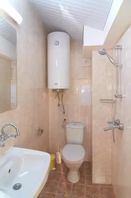 a bathroom with a toilet and a sink at Batak Studio in Burgas City