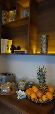a bowl of fruit on a counter in a kitchen at Хотел МИКАДО - онлайн self check-in in Burgas City