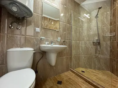 a bathroom with a toilet and a sink and a shower at HORIZON Apartment 8,1 'A' Sveti Vlas in Sveti Vlas