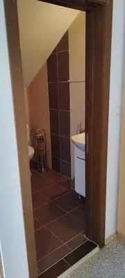 a bathroom with a sink and a toilet and a shower at Anchors Guest House in Sozopol