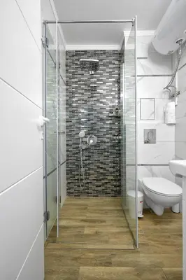 a bathroom with a shower with a glass door at Perfect Seaside Retreat in Sveti Vlas Relax Complex by Flat Mаnаger in Sunny Beach