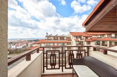 a balcony with a view of a city at Perfect Seaside Retreat in Sveti Vlas Relax Complex by Flat Mаnаger in Sunny Beach
