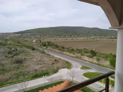 a view of a road from a balcony at Сънрайз Данаилов in Obzor