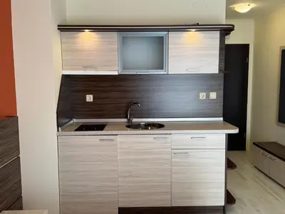 a kitchen with a sink and a microwave at AFRODITA II - 19 Studio Sunny Beach in Sunny Beach