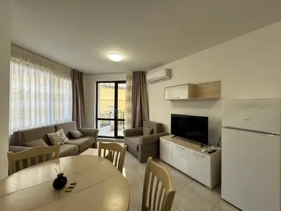 a living room with a couch and a table at HORIZON 1 'A' APARTMENT Sveti Vlas in Sveti Vlas
