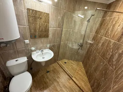 a bathroom with a shower and a toilet and a sink at HORIZON 1 'A' APARTMENT Sveti Vlas in Sveti Vlas