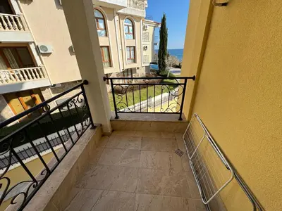 an empty balcony of a building with a gate at HORIZON 13 'A' APARTMENT Sveti Vlas in Sveti Vlas