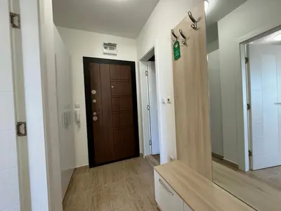 a hallway with a brown door in a room at HORIZON 20 'A' APARTMENT Sveti Vlas in Sveti Vlas