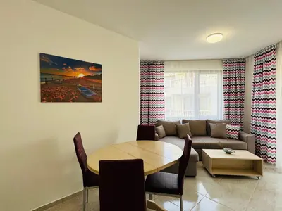 a living room with a couch and a table at HORIZON 26 'Б' Apartment Sveti Vlas in Sveti Vlas