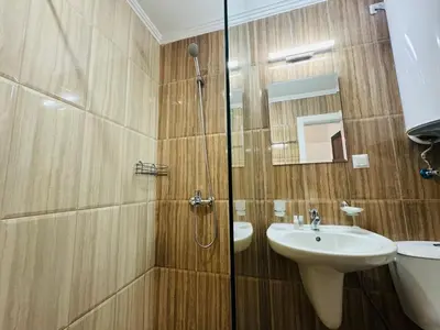 a bathroom with a sink and a shower at HORIZON 26 'Б' Apartment Sveti Vlas in Sveti Vlas