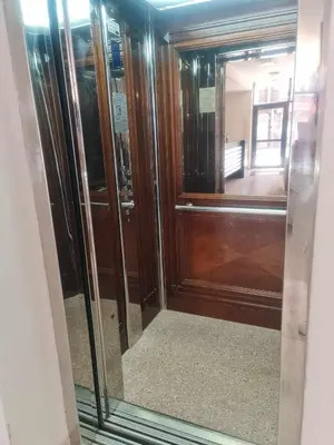 a wooden door in a room with a mirror at Aglaya 2 - Pomorie Bay in Pomorie
