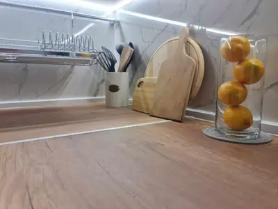 a kitchen counter with a knife block and a bunch of onions at Aglaya 2 - Pomorie Bay in Pomorie