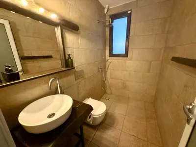 a bathroom with a sink and a toilet at Arthotel Oscar II Sozopol in Sozopol