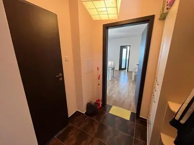 a hallway with a black door and a room at Oasis2 in Nesebar