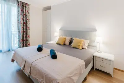 a bedroom with a bed with two pillows on it at Sozopol Созопол MORE SUN 2 Б Sozopolis in Sozopol
