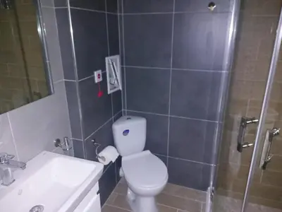 a bathroom with a toilet and a sink and a shower at Brandnew 3 Room Apartment with Poolview in Cascadas Resort in Sunny Beach