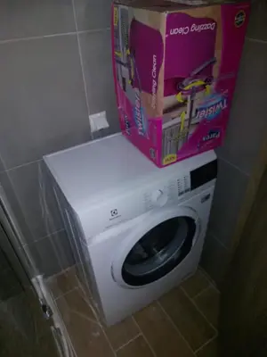 a box on top of a washing machine in a bathroom at Brandnew 3 Room Apartment with Poolview in Cascadas Resort in Sunny Beach