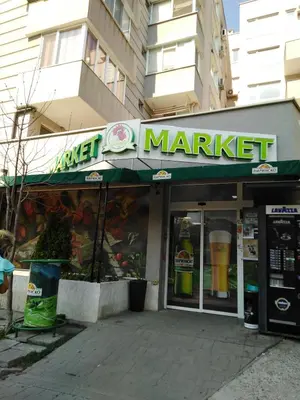a market with a sign on the front of a building at Дом Крумови in Burgas City