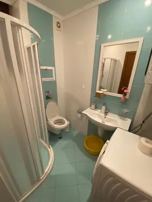 a bathroom with a toilet and a sink and a mirror at Sozopol Santa Marina Sea View Studio in Sozopol