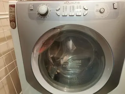 a washing machine with its door open in a bathroom at Апартамент ЛаХабана до плажа в Поморие in Pomorie