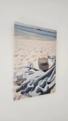 a hat on a blanket on the beach at Sea and Sand Apartment in Sozopol