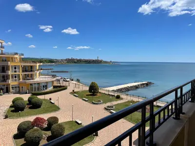 a view of the ocean from a balcony of a building at Midia SP Apartments in Aheloy
