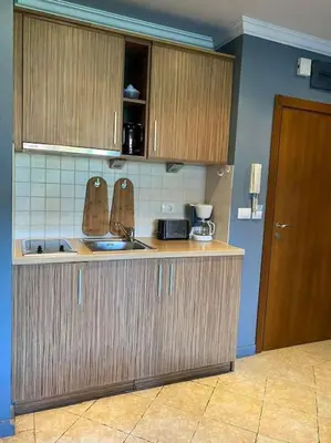 a kitchen with a sink and a counter top at Santa Marina, Lovely 1-bedroom apartment in Sozopol