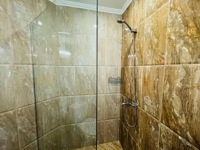 a bathroom with a shower with a glass door at HORIZON 12 'Б' Apartment Sveti Vlas in Sveti Vlas
