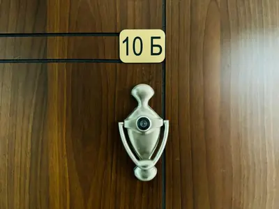 a door with a door knob with the number on it at HORIZON 10 'Б' Apartment Sveti Vlas in Sveti Vlas