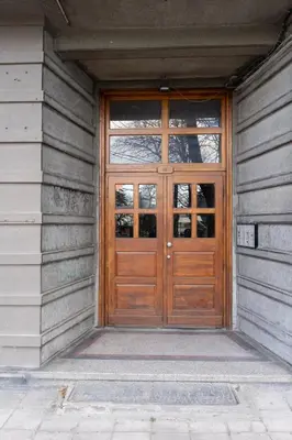 a wooden door on a building with at Seaside Estate - Cozy and Romantic - Public Parking Nearby in Varna City