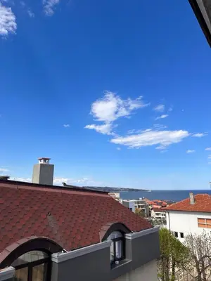 a view of the ocean from the roof of a building at Апартамент 
