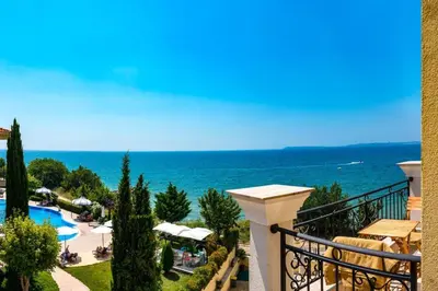 a view of the ocean from the balcony of a resort at HORIZON 33 'Б' Studio Sveti Vlas in Sveti Vlas