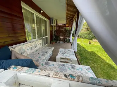 a porch with couches on the side of a house at Sea Salt Suite- Sozopol in Sozopol