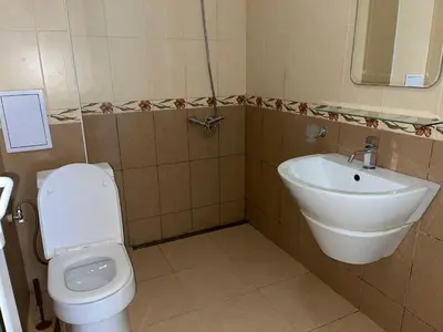 a bathroom with a toilet and a sink at Sea Salt Suite- Sozopol in Sozopol