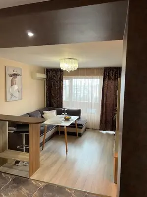 a living room with a couch and a table at Tei-Zi apartments in Burgas City