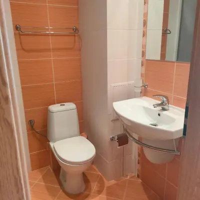 a bathroom with a toilet and a sink at Delta River Park in Sunny Beach