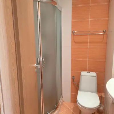 a bathroom with a shower with a toilet and a sink at Delta River Park in Sunny Beach