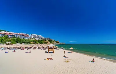 a group of people on a beach near the water at HORIZON 34 'В' Apartment Sveti Vlas in Sveti Vlas