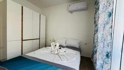 a bedroom with a bed with a towel on it at HORIZON 34 'В' Apartment Sveti Vlas in Sveti Vlas