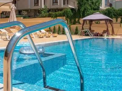 a swimming pool with a slide in a hotel at HORIZON 28 'В' Apartment Sveti Vlas in Sveti Vlas