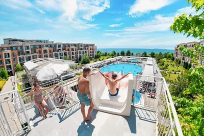a group of people on the upper deck of a resort at Premier Fort Apartment on Seafront in Sveti Vlas