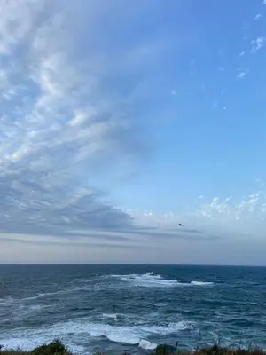 a view of the ocean with a plane in the sky at Порт Лозенец Морска Гледка - Port Lozenets Sea View in Lozenets