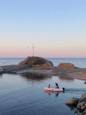 two people in a small boat in the water at Порт Лозенец Морска Гледка - Port Lozenets Sea View in Lozenets
