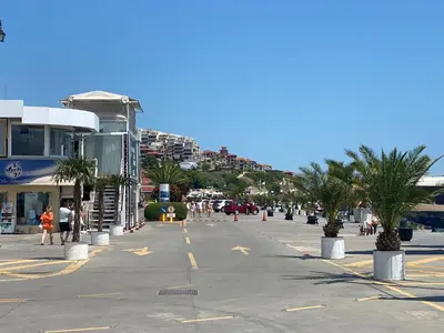 a street in a city with palm trees and buildings at HORIZON 5 'A' Apartment Sveti Vlas in Sveti Vlas