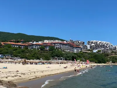 a group of people on a beach with buildings at HORIZON 4 'А' Apartment Sveti Vlas in Sveti Vlas
