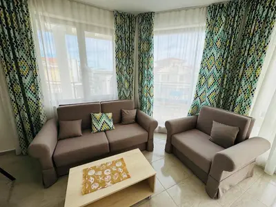 a living room with two couches and a coffee table at HORIZON 2 'В' Apartment Sveti Vlas in Sveti Vlas