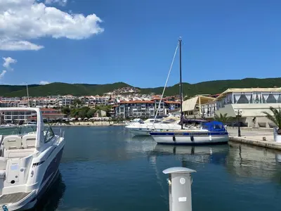 two boats docked in a marina with a city at HORIZON 2 'В' Apartment Sveti Vlas in Sveti Vlas