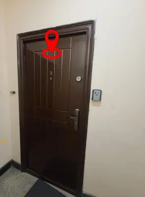 a wooden door with a red arrow on it at Downtown Apartment Varna in Varna City