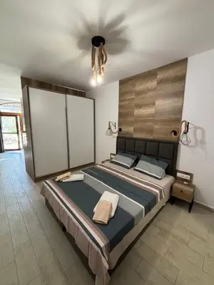 a bedroom with a large bed with a ceiling at Studio/free yoga&aqua aerobic in Sunny Beach