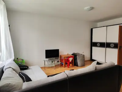 a living room with a couch and a table at Nev in Burgas City
